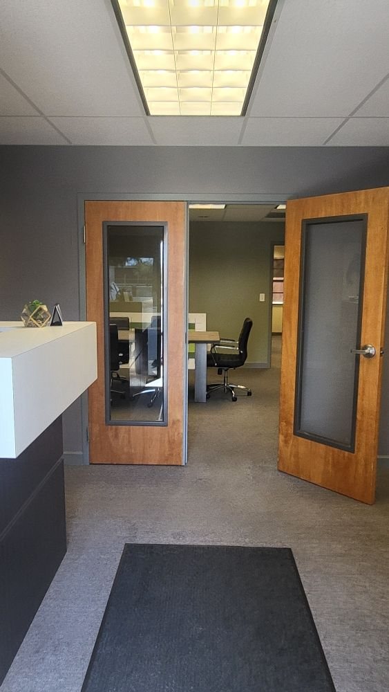 Clean private office suite with glass doors