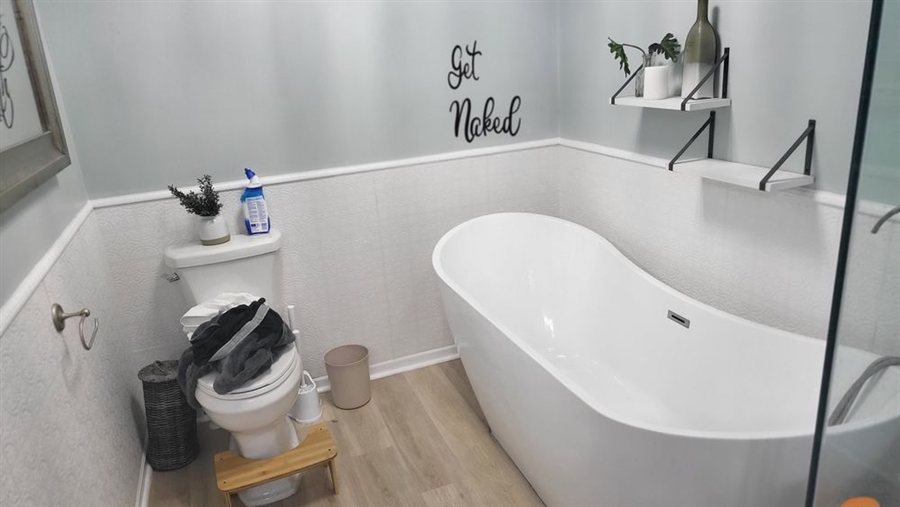 Clean bathroom with freestanding tub