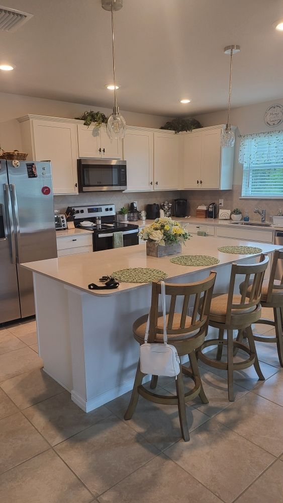 Clean kitchen with island and dining area